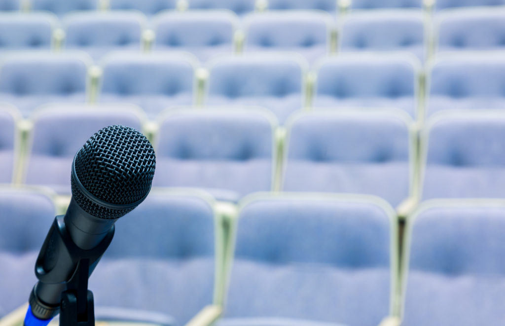 microphone in front of empty auditorium